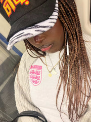 Rabiun customer on the Tube in the Black & Zebra hat
