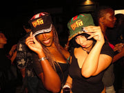 Two Rabiun customers on a night out, both in Rabiun hats