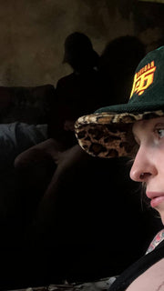 Rabiun customer in the Green & Leopard hat, low light